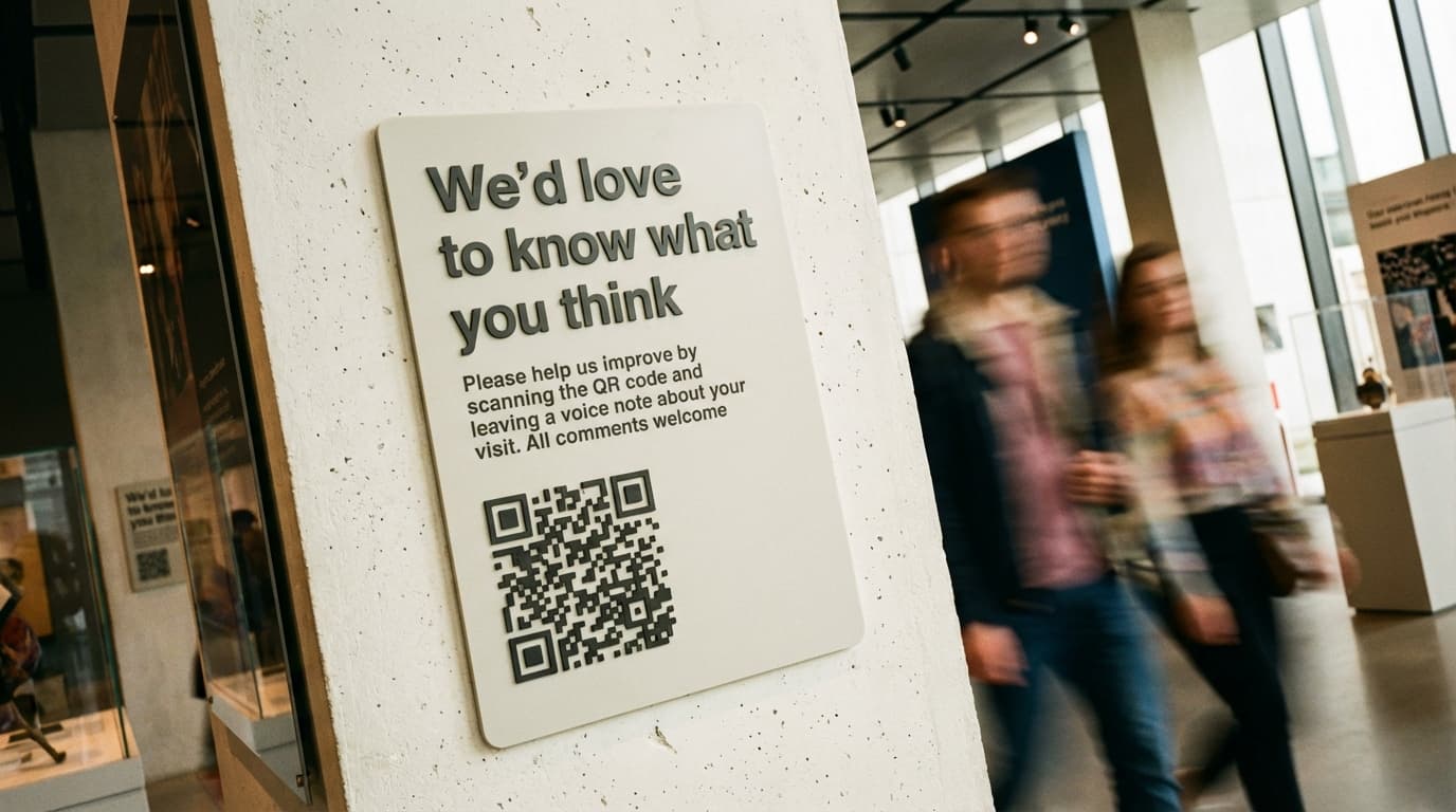 QR code displayed on gallery wall for visitor feedback